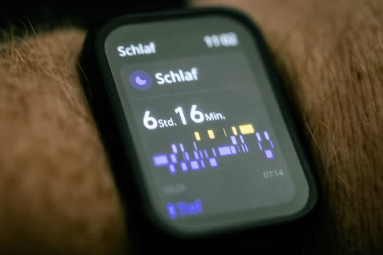 Smartwatch displaying sleep tracking interface, illustrating modern technology's role in monitoring sleep patterns for longevity. The digital health metrics shown emphasize how tracking sleep quality contributes to a longer, healthier lifespan