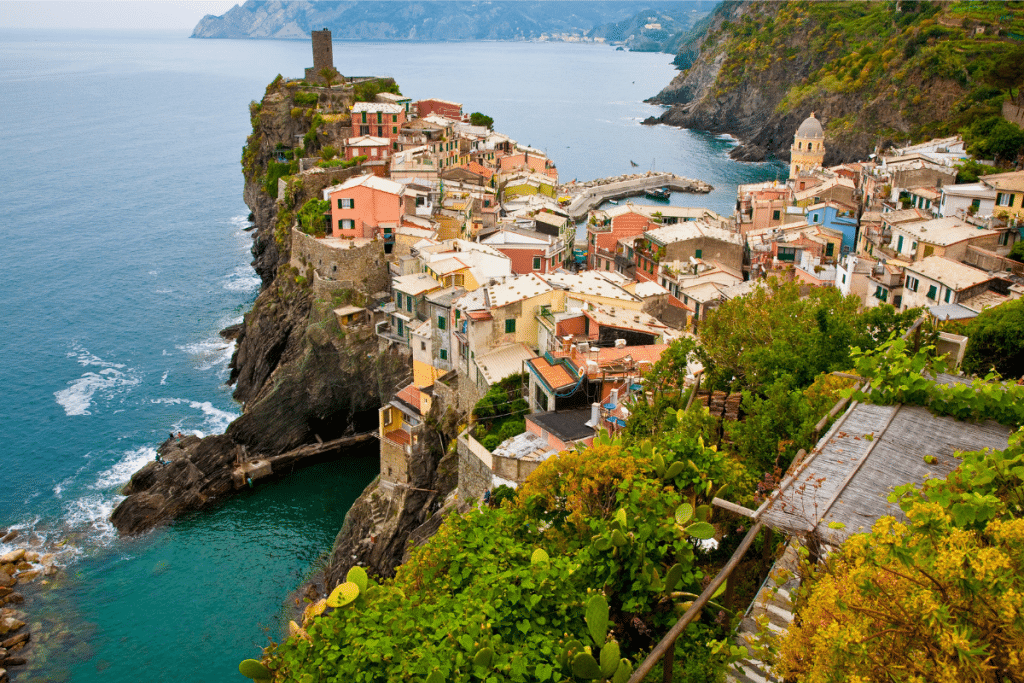 A view of Vernazza, a coastal village in Cinque Terre, Italy, showcasing the Mediterranean lifestyle and fresh ingredients central to the Mediterranean Plant Based Diet.